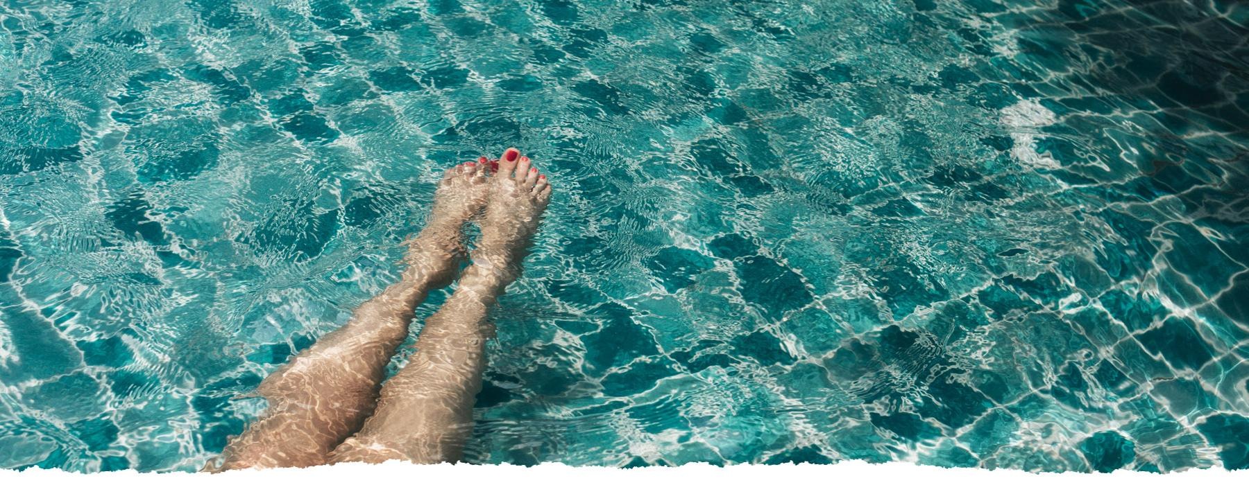 a person's feet in the water